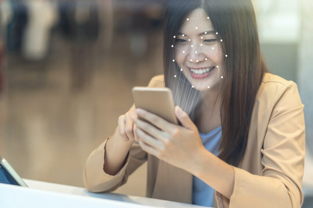 Asian women using the technology tablet for access control by face recognition