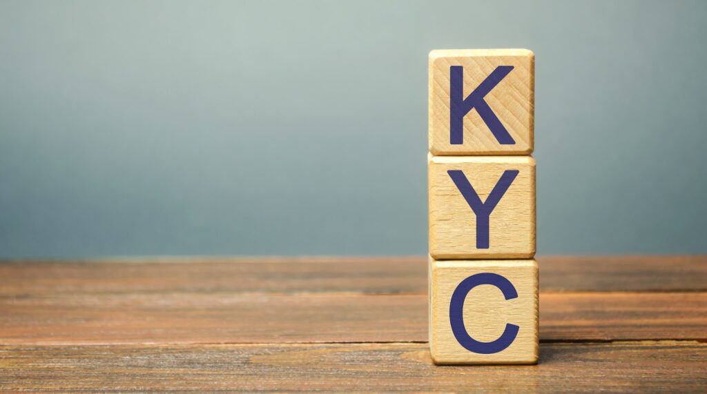 Wooden blocks with the word KYC - Know Your Customer / Client.