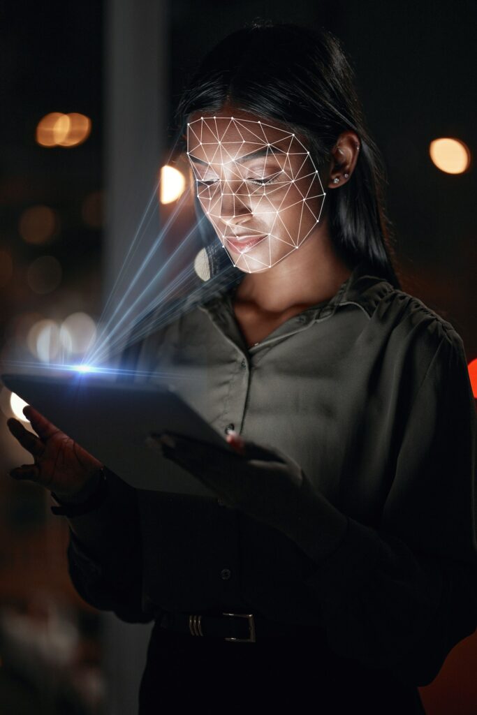 Woman, tablet and facial recognition at night in biometrics for access, verification or identificat